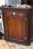 Georgian oak corner wall cabinet having arched fielded panel door, 81cm by 98.5cm.