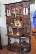 Victorian heavily carved oak mirror back hall stand, 131cm by 222cm.