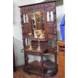 Victorian heavily carved oak mirror back hall stand, 131cm by 222cm.