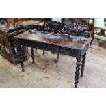 Victorian carved oak side table having a drawer to one end and raised on bobbin legs, 122cm by 77cm.
