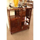 Oriental hardwood two drawer shelf unit 99cm by 112cm and an Oriental four door sideboard,