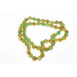 Chinese hardstone green and amber tinted beads.