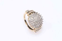 Diamond cluster ring set in 14Kt gold, comprising seventy diamonds, size N.