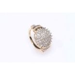 Diamond cluster ring set in 14Kt gold, comprising seventy diamonds, size N.