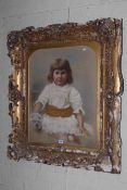 Ornate gilt framed portrait of a child, 100cm by 85cm overall.