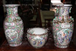 Pair of large Cantonese style vases (62cm high) and jardiniere (25cm high).