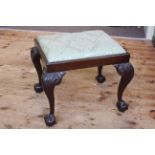 Mahogany Chippendale style stool on ball and claw legs.