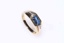 9 carat gold and sapphire ring, the rectangular sapphire flanked by rows of small diamonds, size W.