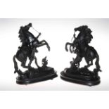 Pair of Spelter Marley horses and warriors on wooden plinths, 33cm high.