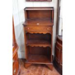 Slim inlaid mahogany gallery backed open bookcase with a single drawer, 52cm by 114cm.