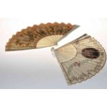Two antique ivory fans, both painted with panels and foliage.