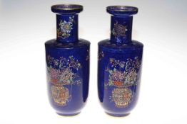 Pair Carlton Ware vases with enamel and gilt on blue ground, 31cm.