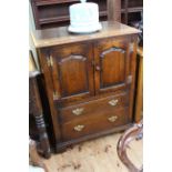 Titchmarsh & Goodwin English Oak cabinet having two arched fielded panel doors above two drawers,