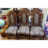 Six Victorian heavily carved oak dining chairs (4x2).