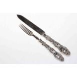Ornate Victorian silver serving knife and fork.