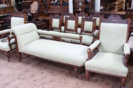 Late Victorian carved walnut nine piece parlous suite comprising chaise longue,