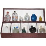 Collection of nine Chinese hardstone and glass snuff bottles.