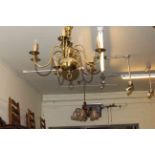 Brass hanging ceiling light with ruby glass shade,