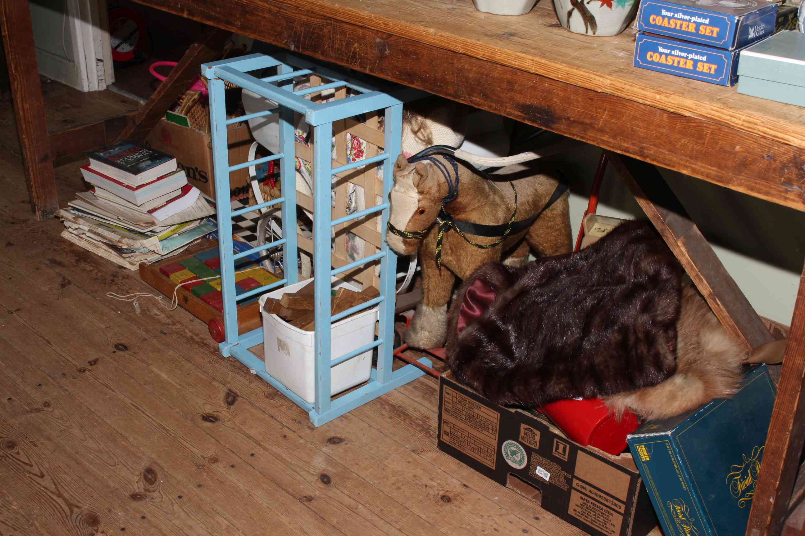 Collection of toys, games, books, furs, pram, pull-along horse.