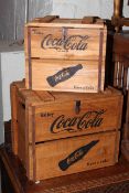 Two wooden Coca Cola crates.