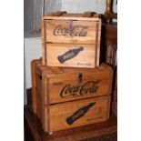 Two wooden Coca Cola crates.