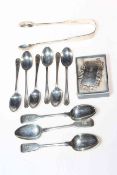 Silver teaspoons, tongs and Sherry label.