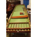 Vintage bar billiards table, cues and accessories.