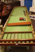 Vintage bar billiards table, cues and accessories.