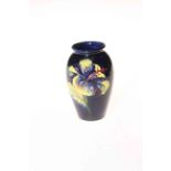 Moorcroft pottery Hibiscus vase on blue ground, 10cm.