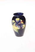 Moorcroft pottery Hibiscus vase on blue ground, 10cm.