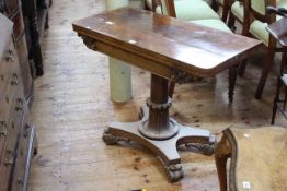 19th Century rosewood fold top card table on turned pedestal to quadriform base, 91.