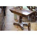 19th Century rosewood fold top card table on turned pedestal to quadriform base, 91.