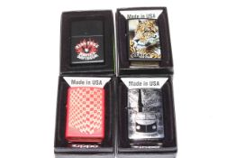 Four boxed Zippo lighters, as new.