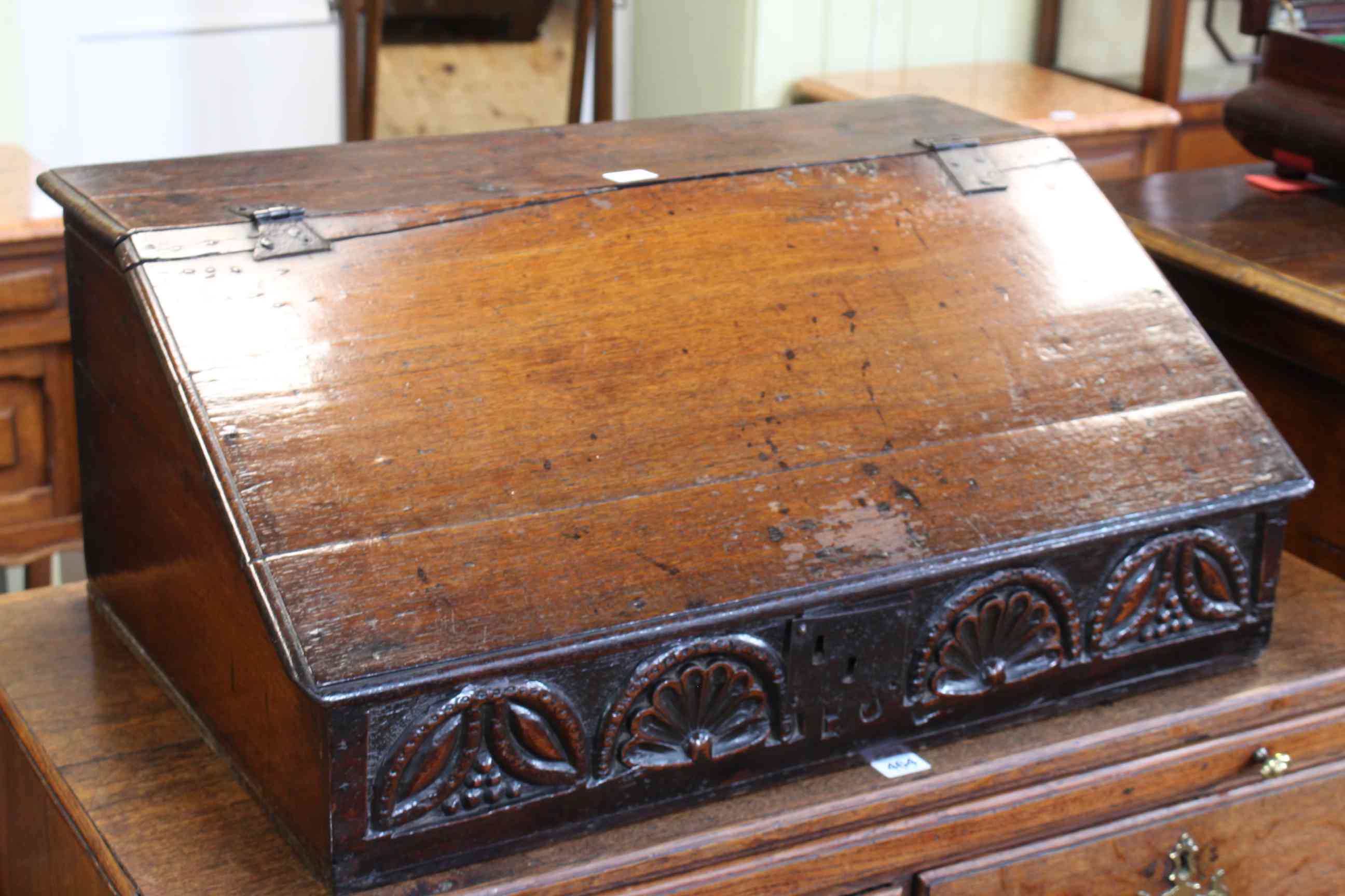 Antique oak bible box, the slope front lid enclosing five drawers, 31cm by 72cm.