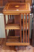 Edwardian mahogany and satinwood inlaid two tier revolving bookcase, 86cm by 46cm.