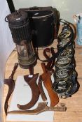 Collection of horsebrasses, antique knitting sheathes, oil lamp,