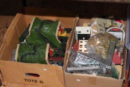 Two boxes of model railway trains and accessories.