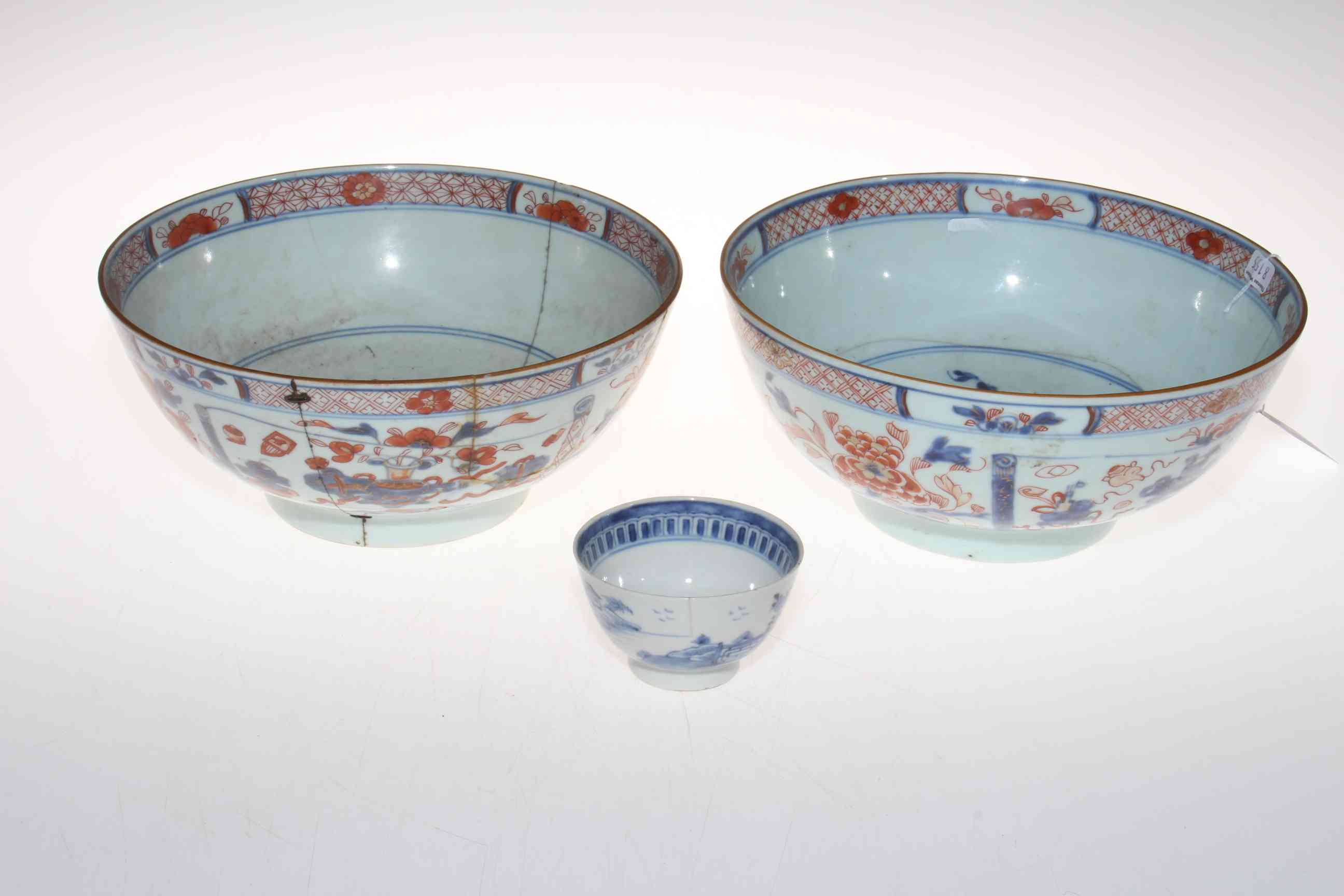 Two antique Chinese blue and iron red bowls and a tea bowl (3).