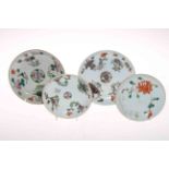 Four antique Chinese polychrome saucer dishes.