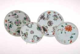 Four antique Chinese polychrome saucer dishes.