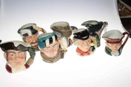 Collection of seven Royal Doulton character jugs including The Walrus and Carpenter.