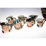 Collection of seven Royal Doulton character jugs including The Walrus and Carpenter.