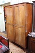 Early 20th Century mahogany double panelled door wardrobe on splayed legs, 199cm by 140cm.