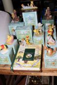 Collection of eleven boxed Royal Doulton Winnie The Pooh figures, two Border Fine Arts pieces,