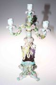 Continental porcelain cherub and flower encrusted candelabrum, 54cm.