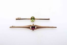 Two 9 carat gold tie pins each set with gemstone.