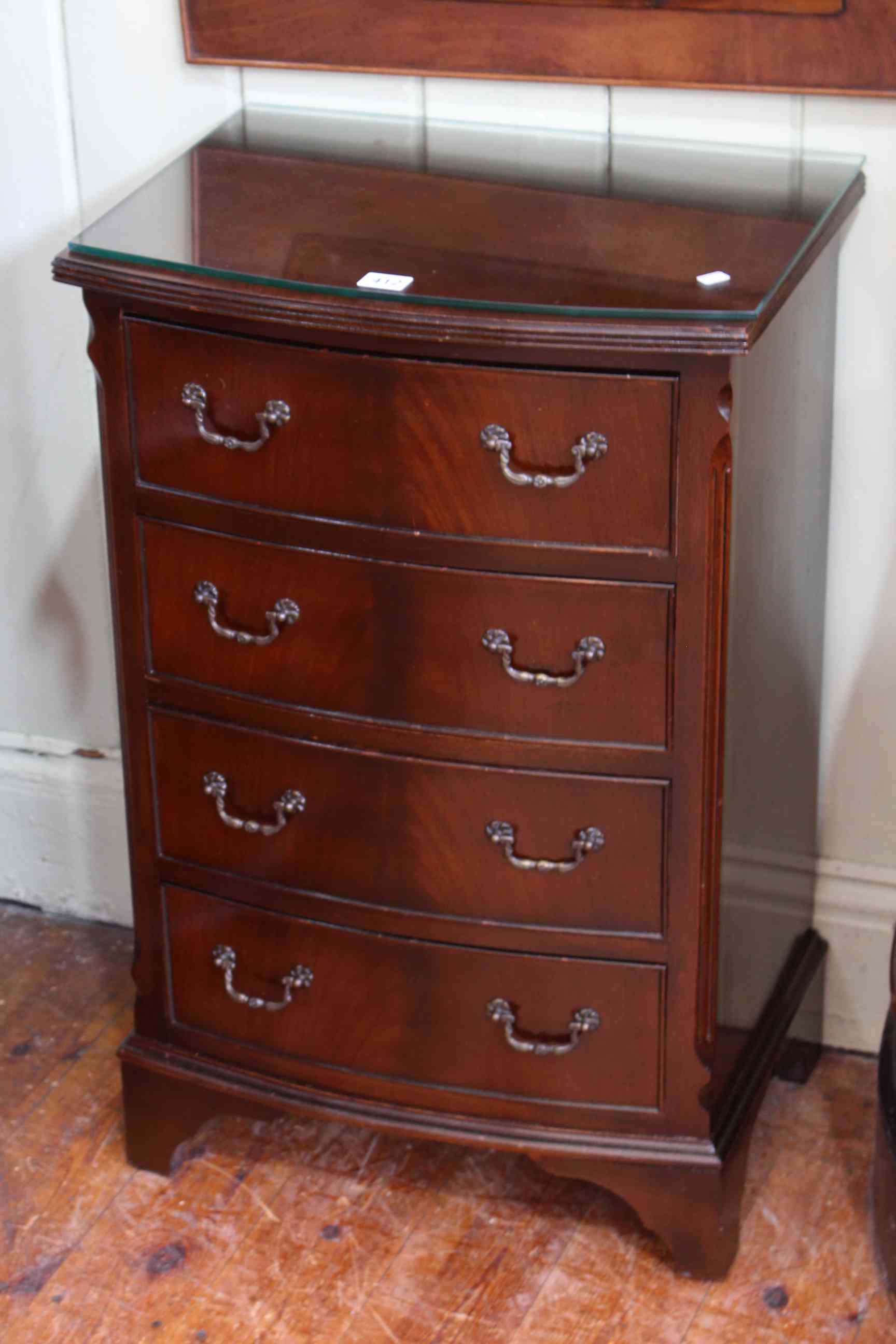 Slim mahogany four drawer bow front chest, 75cm by 48cm.