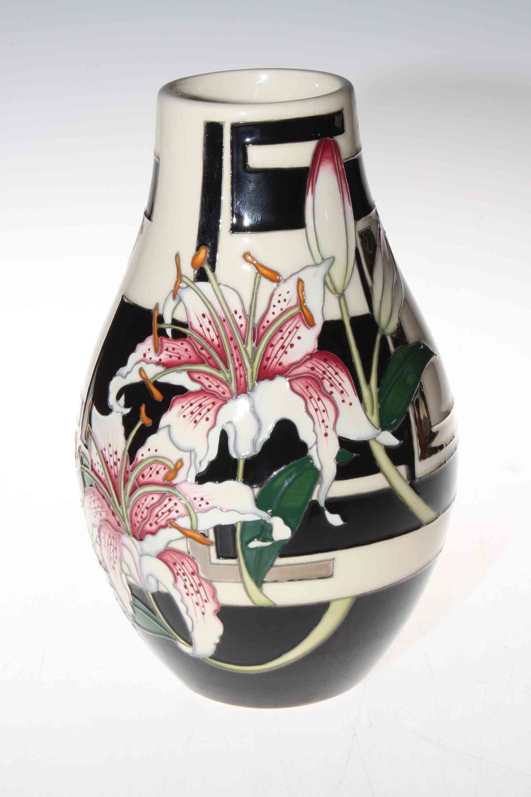 Moorcroft Sgazer 117/9 vase depicting Lily flowers, 26cm.