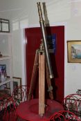 Brass vintage style telescope on wood tripod base.