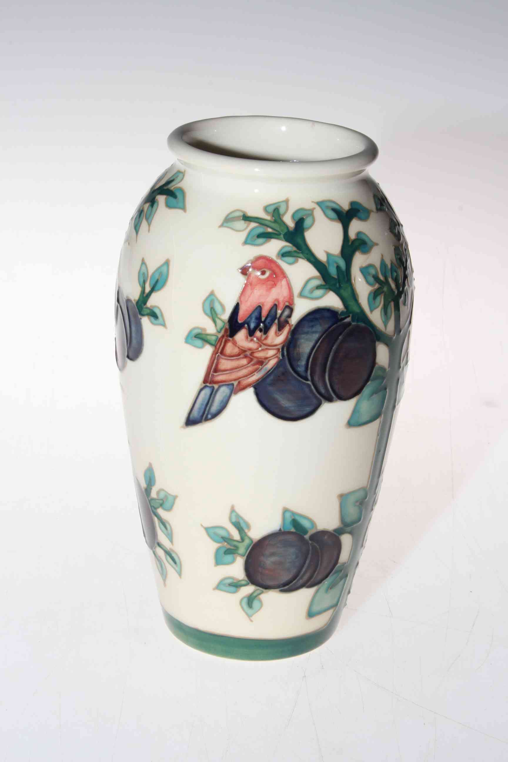 Moorcroft vase depicting tree and bird, 20cm.
